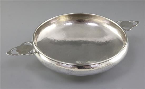 A George V Arts & Crafts silver bowl, by Albert Edward Jones, Diameter to handles 281mm, weight 9.8oz/305grms